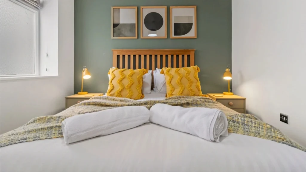 A plush single bed in a luxury room at Grange House, providing a serene and restful atmosphere near Birmingham.