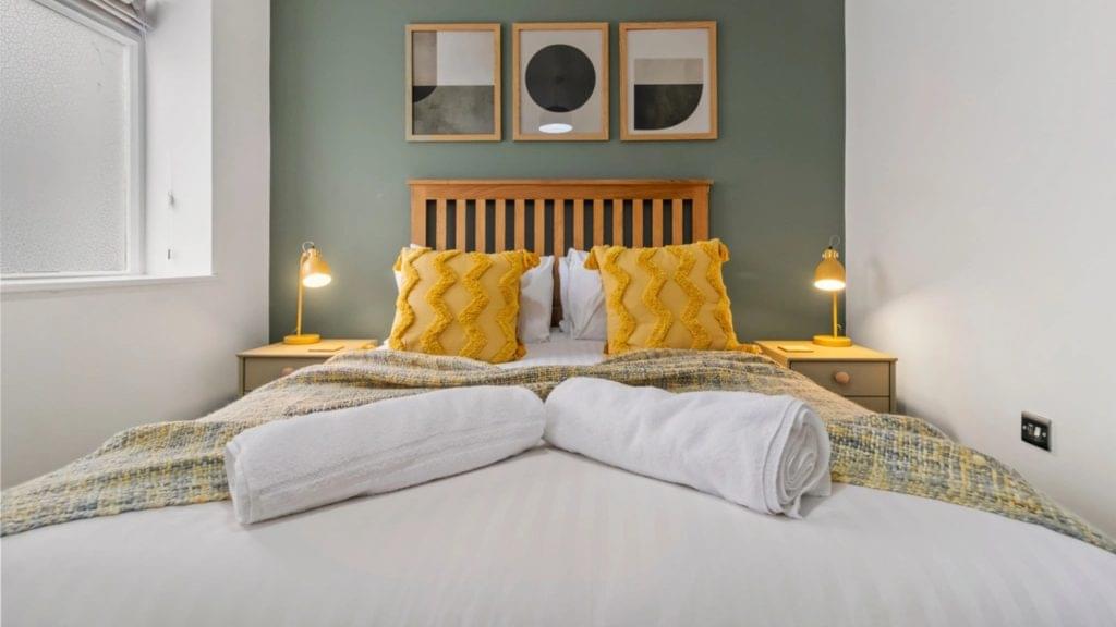 A plush single bed in a luxury room at Grange House, providing a serene and restful atmosphere near Birmingham.